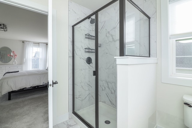 full bath featuring a marble finish shower, marble finish floor, and ensuite bath