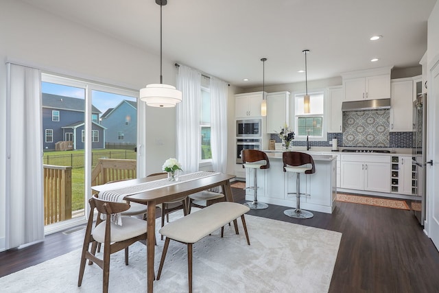 dining space featuring recessed lighting, visible vents, and dark wood-type flooring