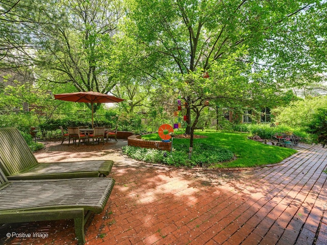 view of patio featuring outdoor dining area