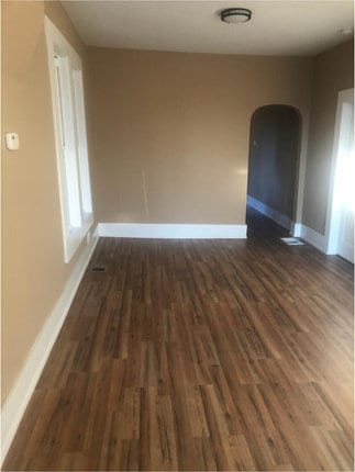 spare room featuring dark hardwood / wood-style flooring