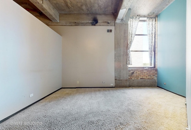 empty room featuring carpet and visible vents