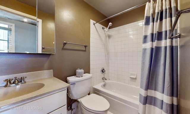 bathroom with shower / bath combo, vanity, and toilet