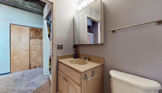 bathroom with toilet and vanity