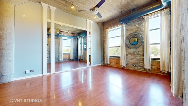 unfurnished room featuring ceiling fan and wood finished floors