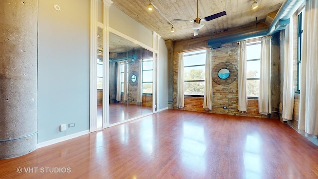 unfurnished room featuring a ceiling fan and wood finished floors