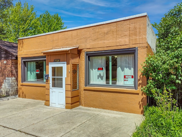 view of front of house with a patio area