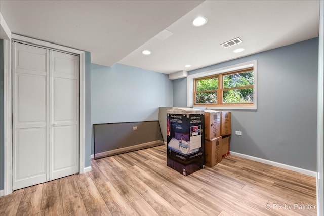 unfurnished room featuring light hardwood / wood-style floors