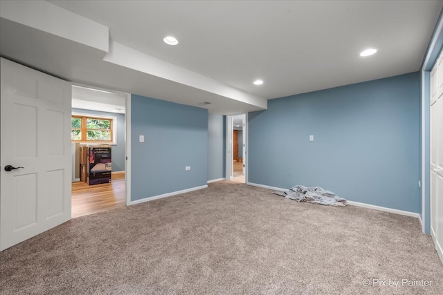 basement with light colored carpet