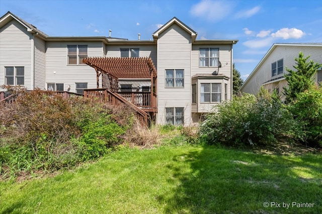 rear view of house with a pergola and a yard