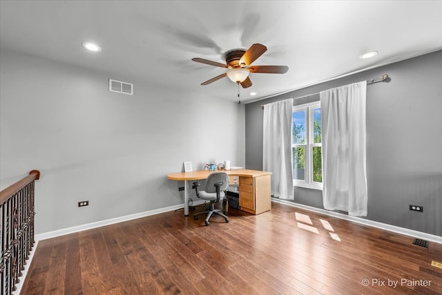 unfurnished office with wood-type flooring and ceiling fan