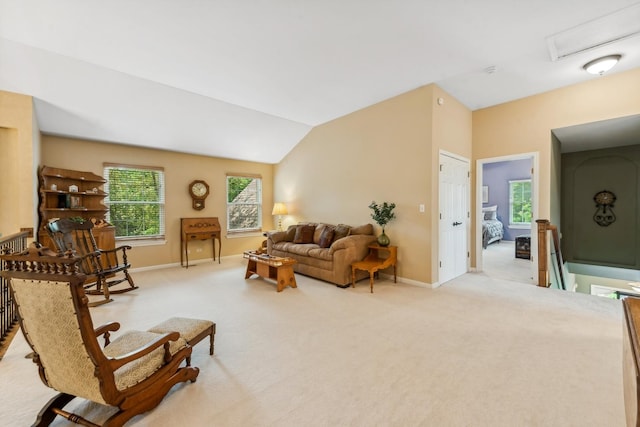 carpeted living room featuring baseboards, vaulted ceiling, and a baseboard radiator