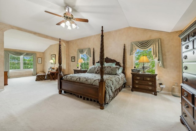 bedroom with vaulted ceiling, carpet, and a ceiling fan