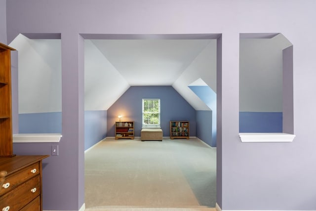 carpeted bedroom featuring vaulted ceiling