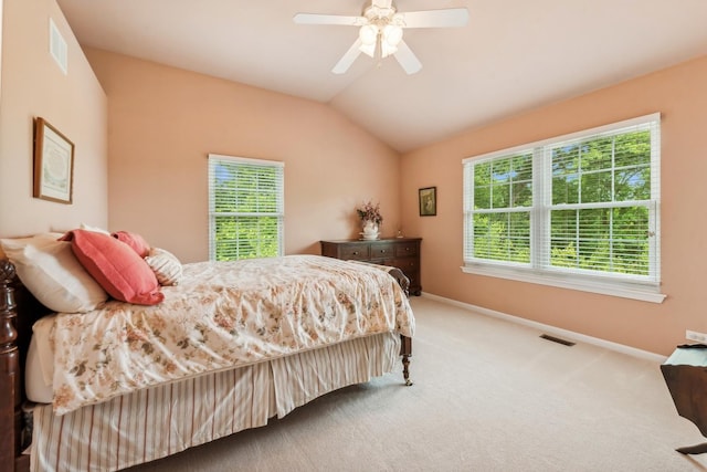 carpeted bedroom with baseboards, lofted ceiling, and a ceiling fan