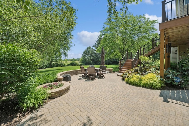 view of patio / terrace featuring stairs and outdoor dining area