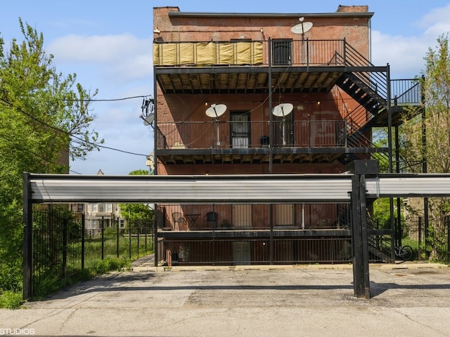 rear view of house with a balcony