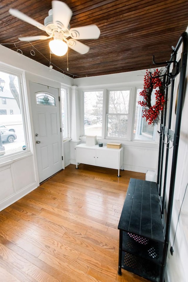 entrance foyer featuring a wealth of natural light, ceiling fan, and wood ceiling