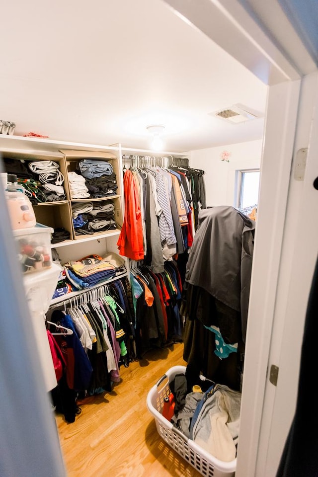 walk in closet featuring wood-type flooring