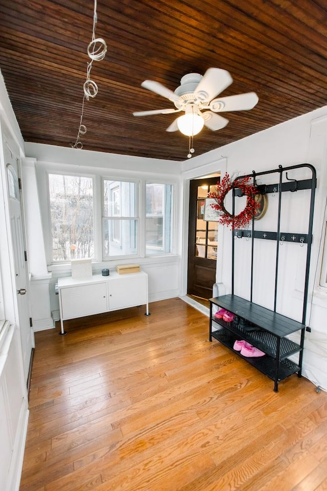 interior space featuring ceiling fan and wood ceiling