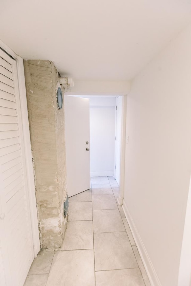 corridor featuring light tile patterned flooring