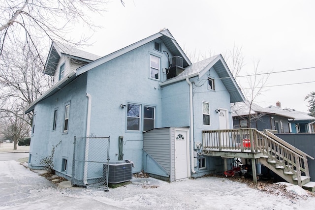 rear view of house with central air condition unit