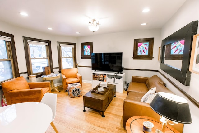 living room with light hardwood / wood-style flooring