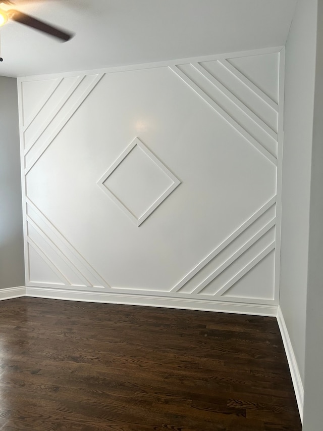 interior space with ceiling fan and dark hardwood / wood-style floors