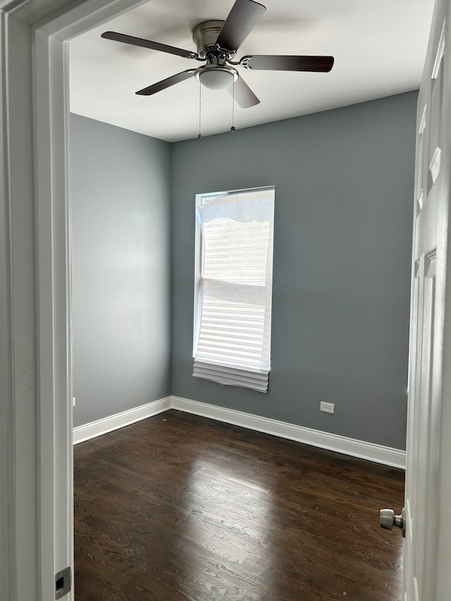 empty room with hardwood / wood-style floors and ceiling fan