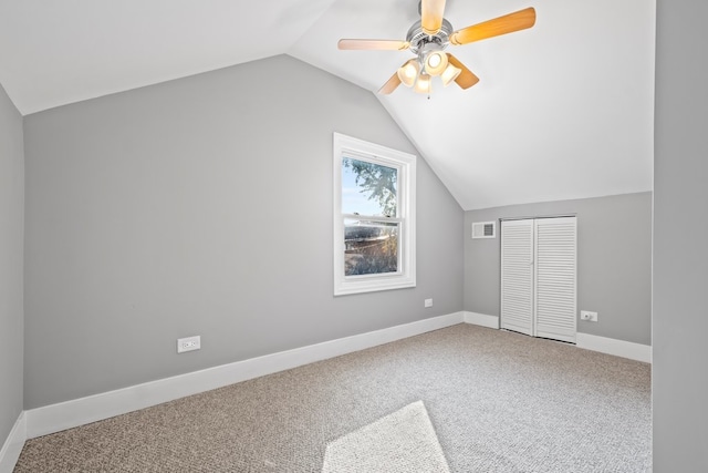 additional living space with ceiling fan, carpet, and vaulted ceiling