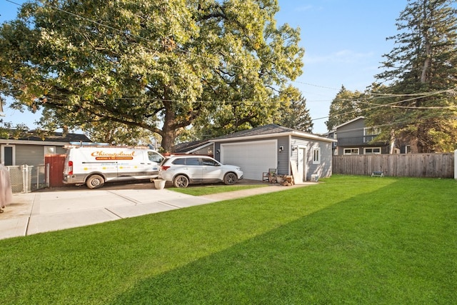 view of yard featuring an outbuilding and a garage