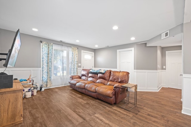 living room featuring dark wood-type flooring