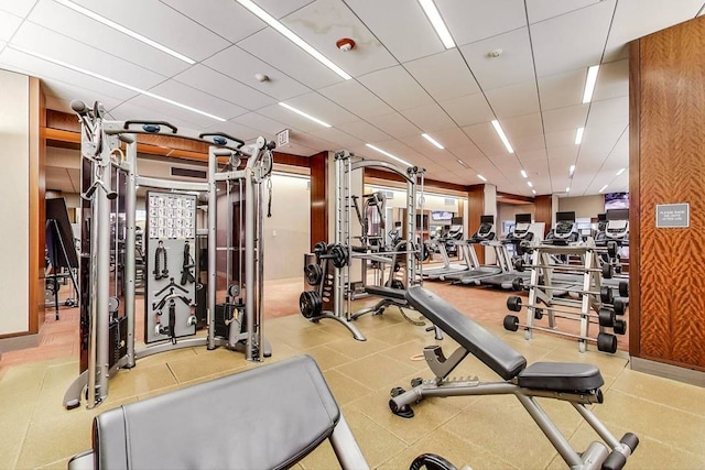 workout area with a drop ceiling