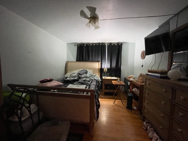 bedroom featuring ceiling fan and light wood-type flooring