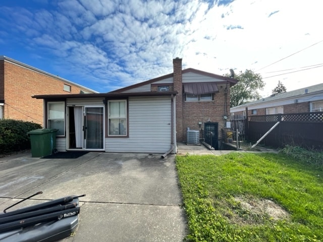 back of property featuring a patio and central air condition unit