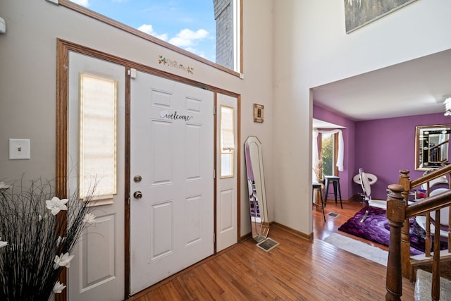 entrance foyer with hardwood / wood-style floors