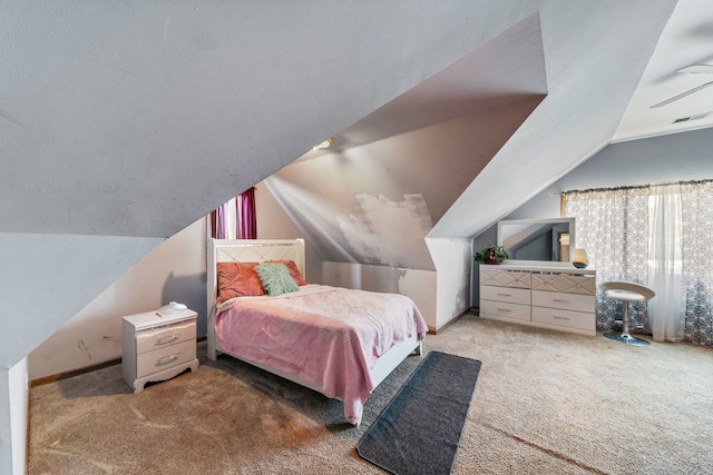 bedroom featuring vaulted ceiling and light colored carpet