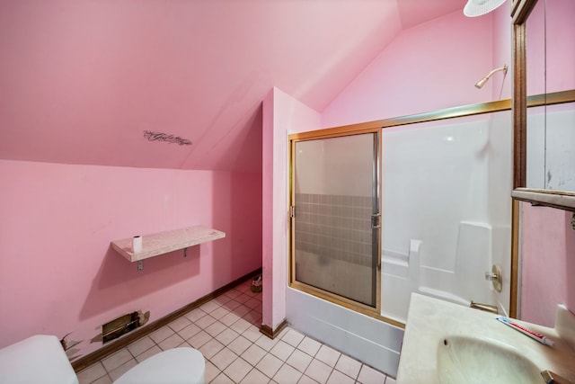 bathroom with tile floors, sink, lofted ceiling, and toilet