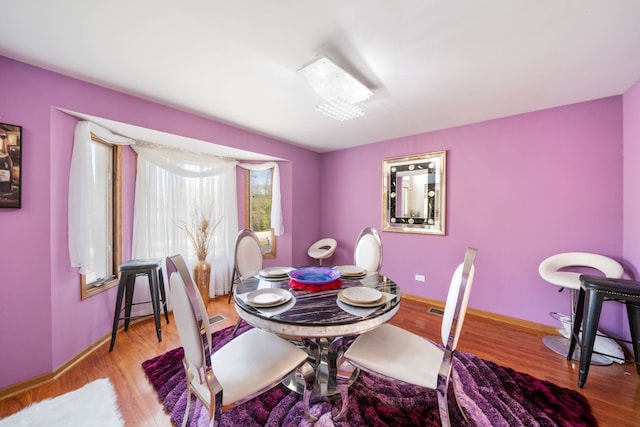 dining space featuring light wood-type flooring