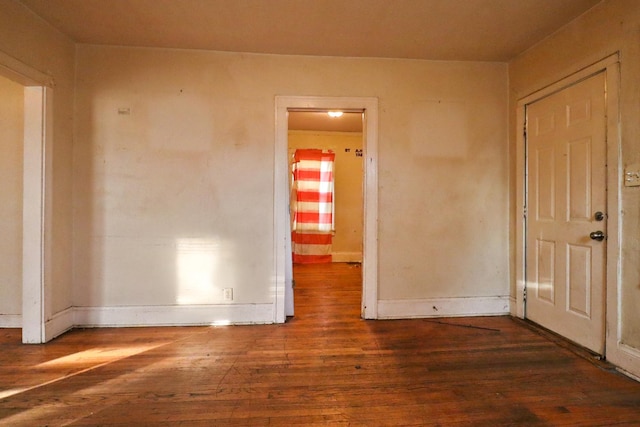 spare room featuring dark hardwood / wood-style flooring