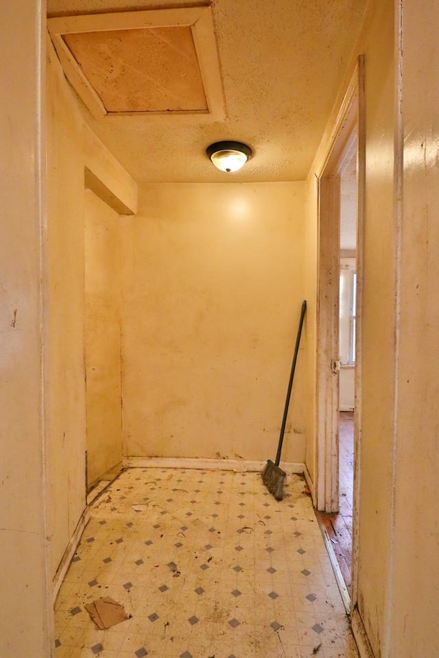 interior space featuring a textured ceiling