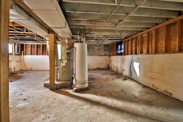 basement featuring gas water heater and heating unit