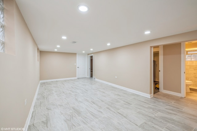 basement featuring light tile floors