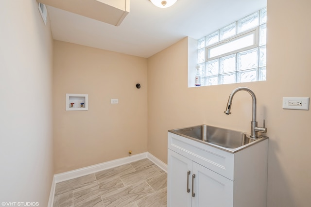 laundry room featuring light tile floors, cabinets, sink, hookup for a washing machine, and hookup for an electric dryer