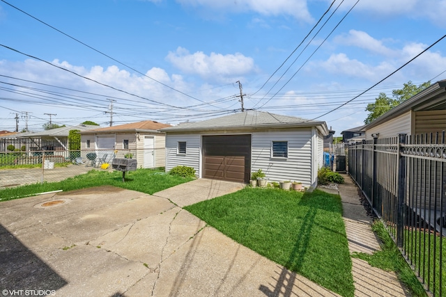 bungalow featuring an outdoor structure, a front yard, and a garage