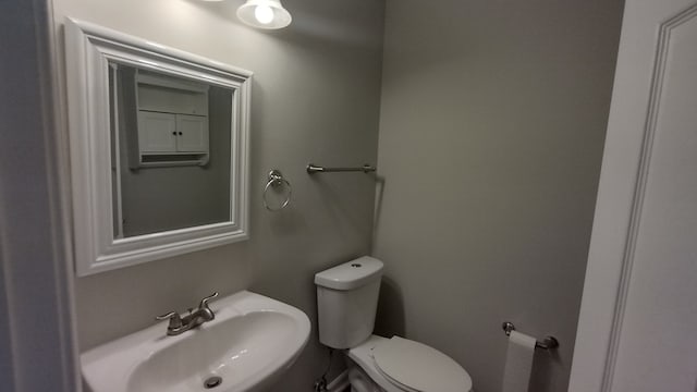 bathroom with sink and toilet