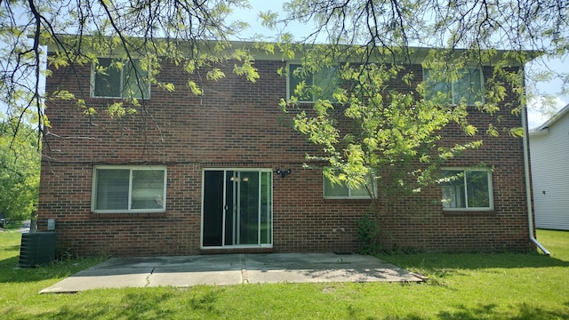 back of property featuring a patio area, a yard, and central AC unit