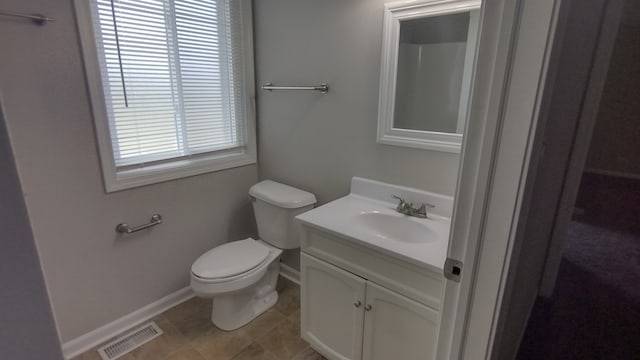 bathroom featuring tile flooring, oversized vanity, and toilet