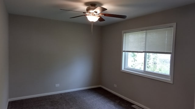 unfurnished room featuring ceiling fan and carpet