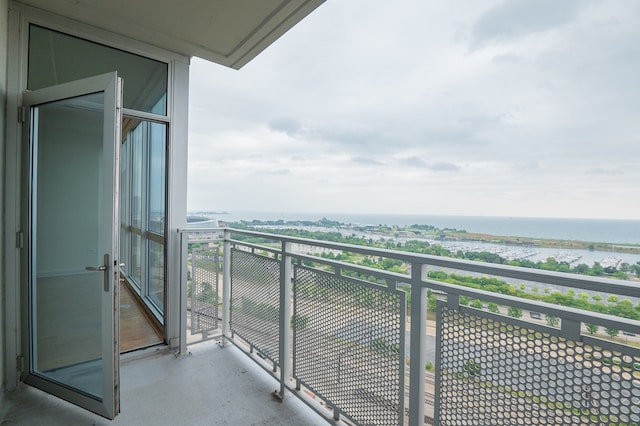 balcony featuring a water view