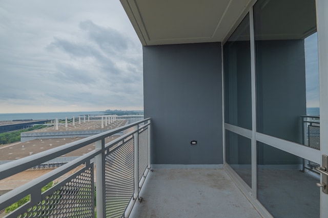 balcony featuring a water view